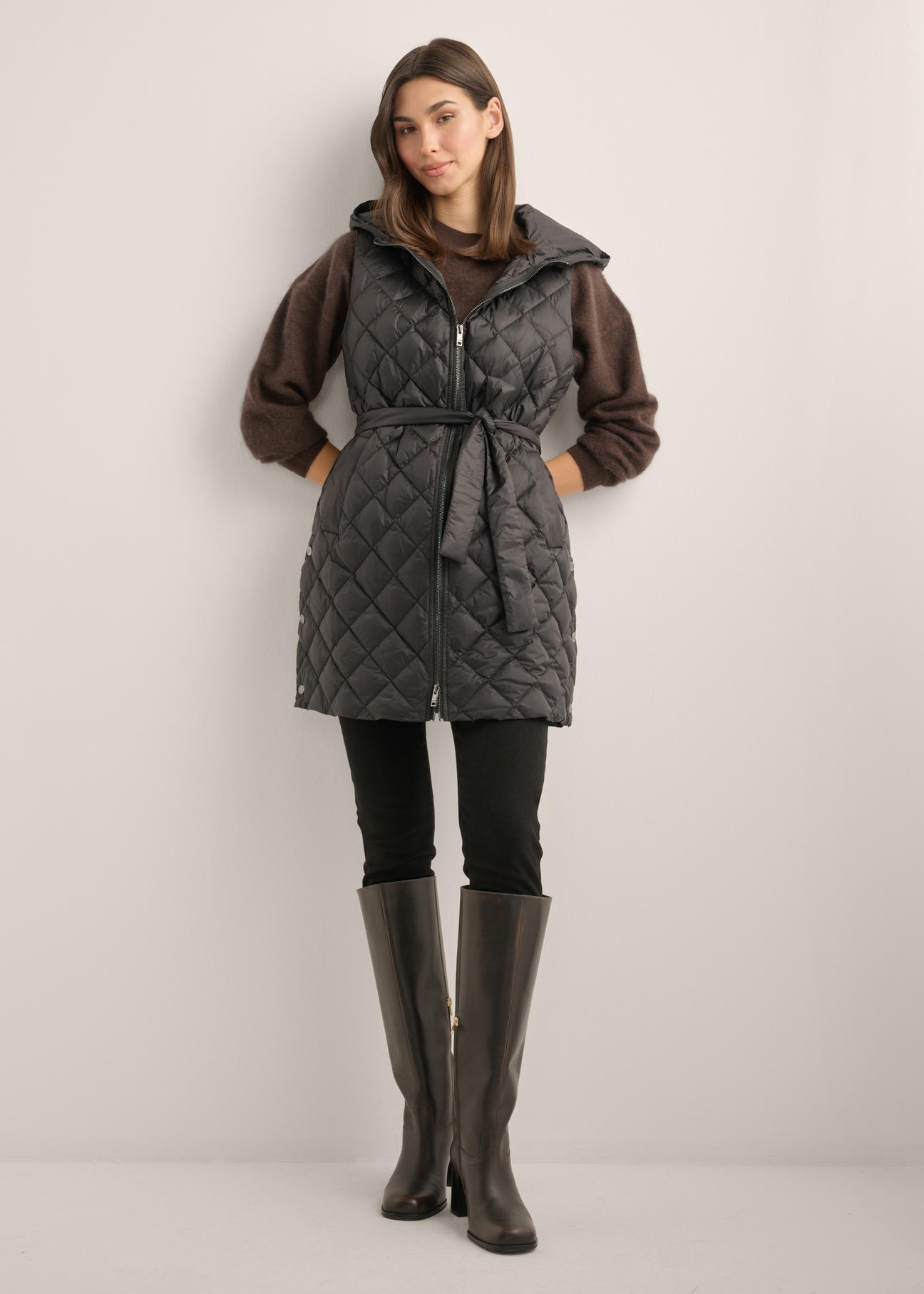 Women's black quilted vest KAMDT-0041-99(Z26), front view of the product on a model. Full body visible.