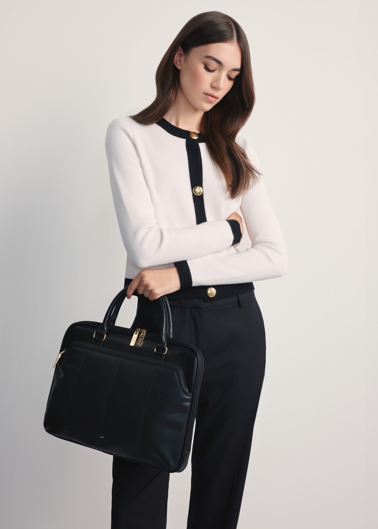 Black women's imitation leather briefcase TOREC-1106-99(Z25) - front view of the product on a model against a white background. Knee-length silhouette visible.