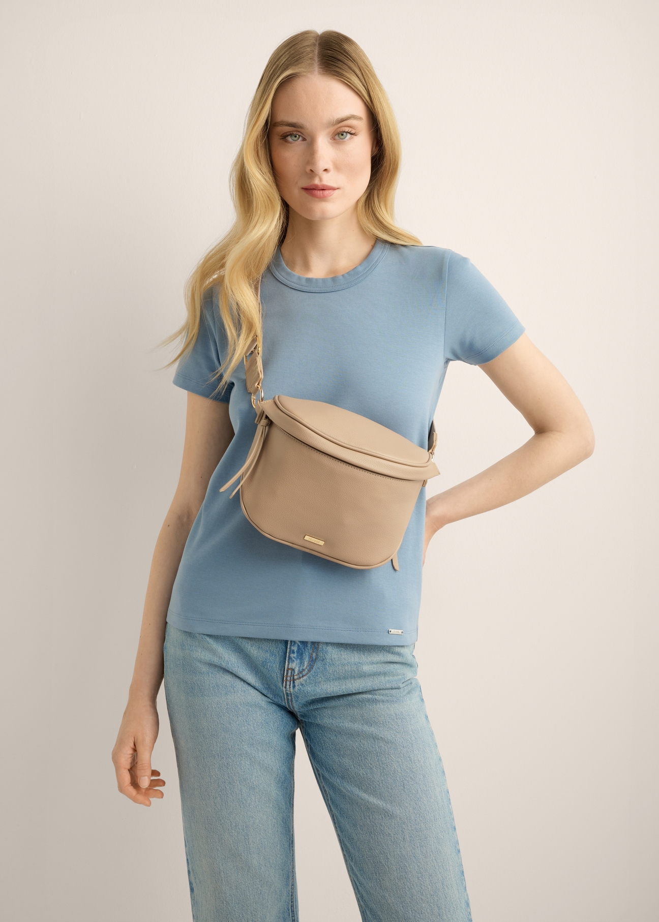 Large beige women's belt bag TOREC-1266-1B(Z26). Model shot.
