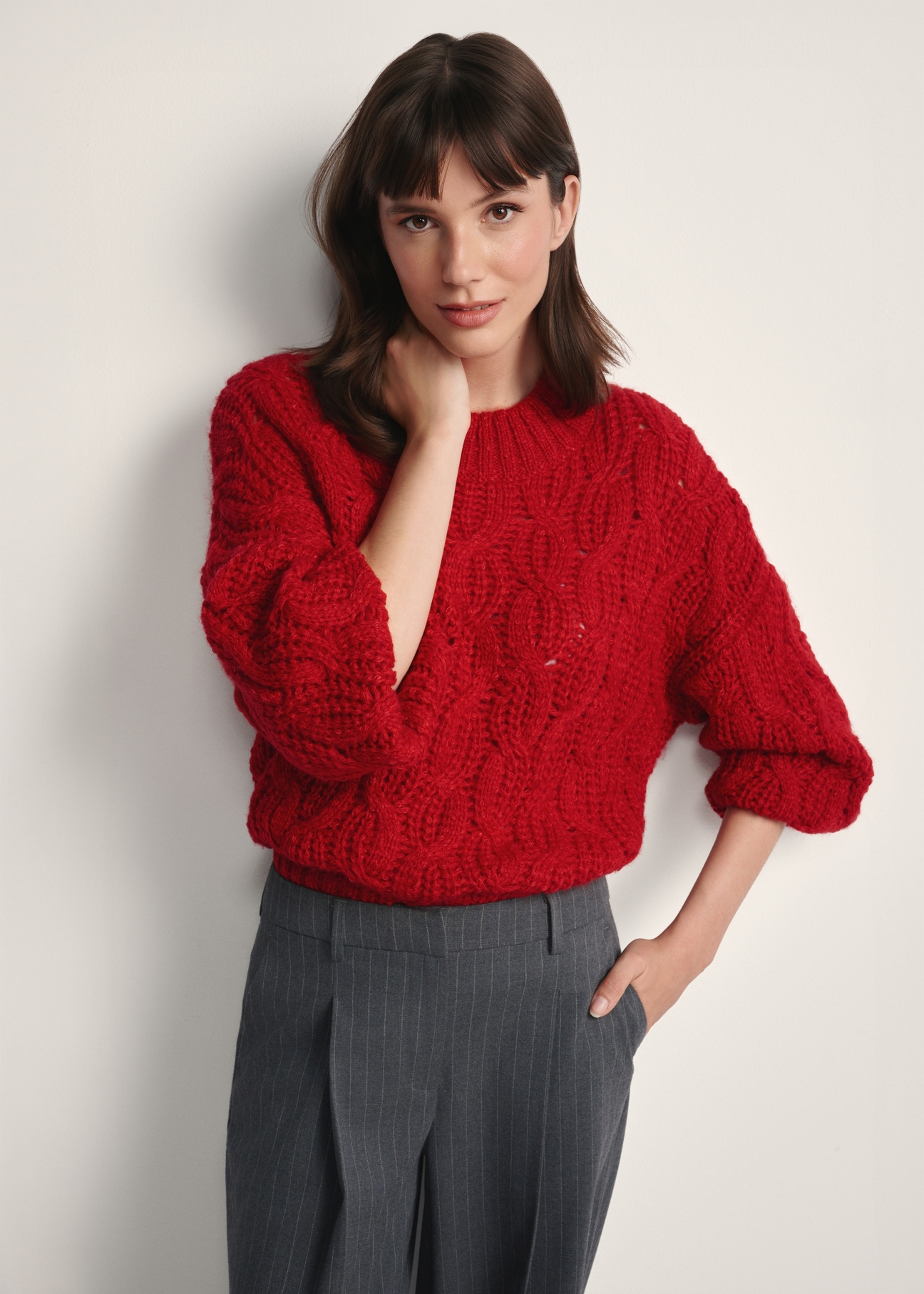 Red women's sweater SWEDT-0236-42(Z25), front view of the product on the model. Half of the silhouette visible.