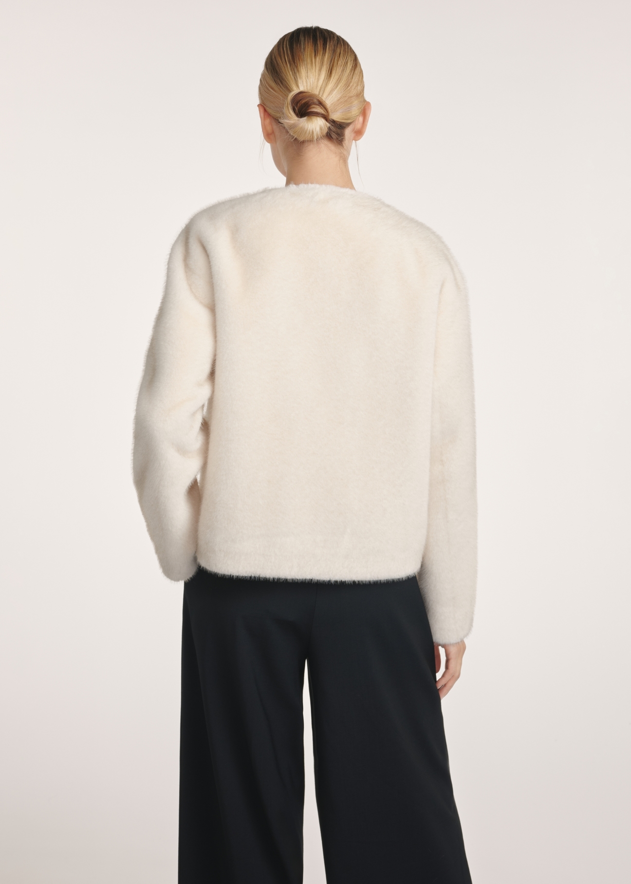 Cream women's fur coat FUTDP-0068-12(Z25), back view of the product on the model. Half of the silhouette visible.