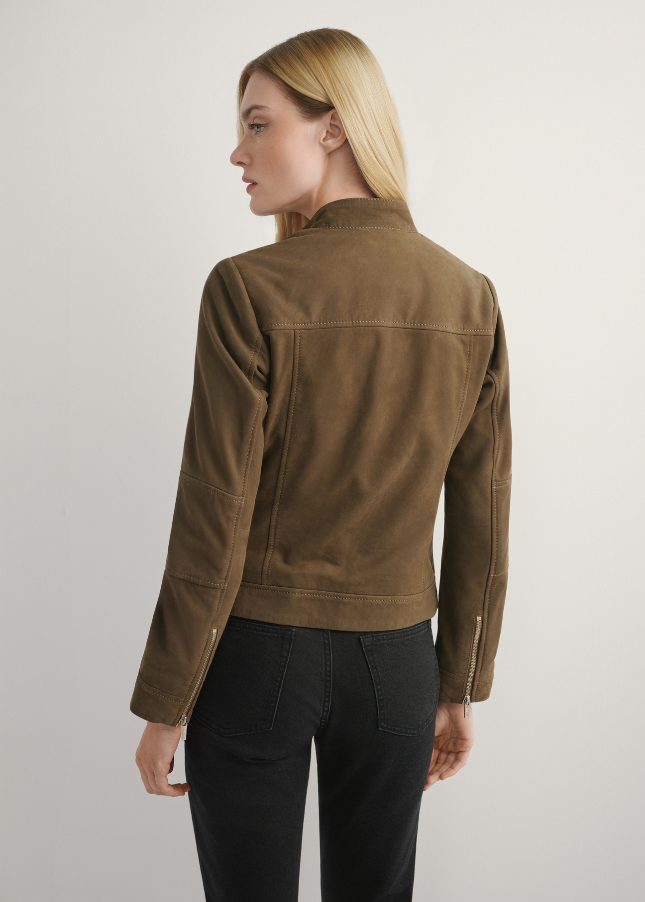 Women's brown leather jacket KURDS-0611-1H(W26), back view of the product on the model. Half of the silhouette visible.