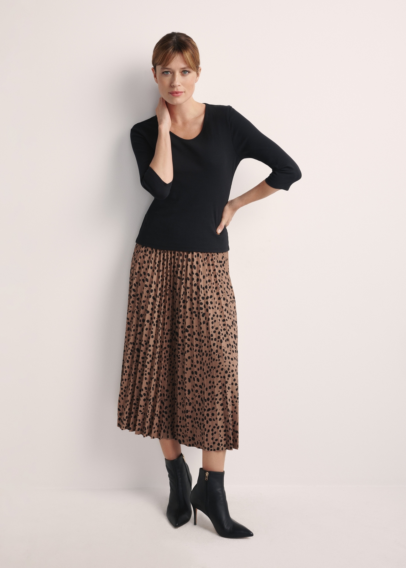 Black women's V-neck blouse LSLDT-0036-99(Z24), product view from the front on the model, the entire silhouette is visible.