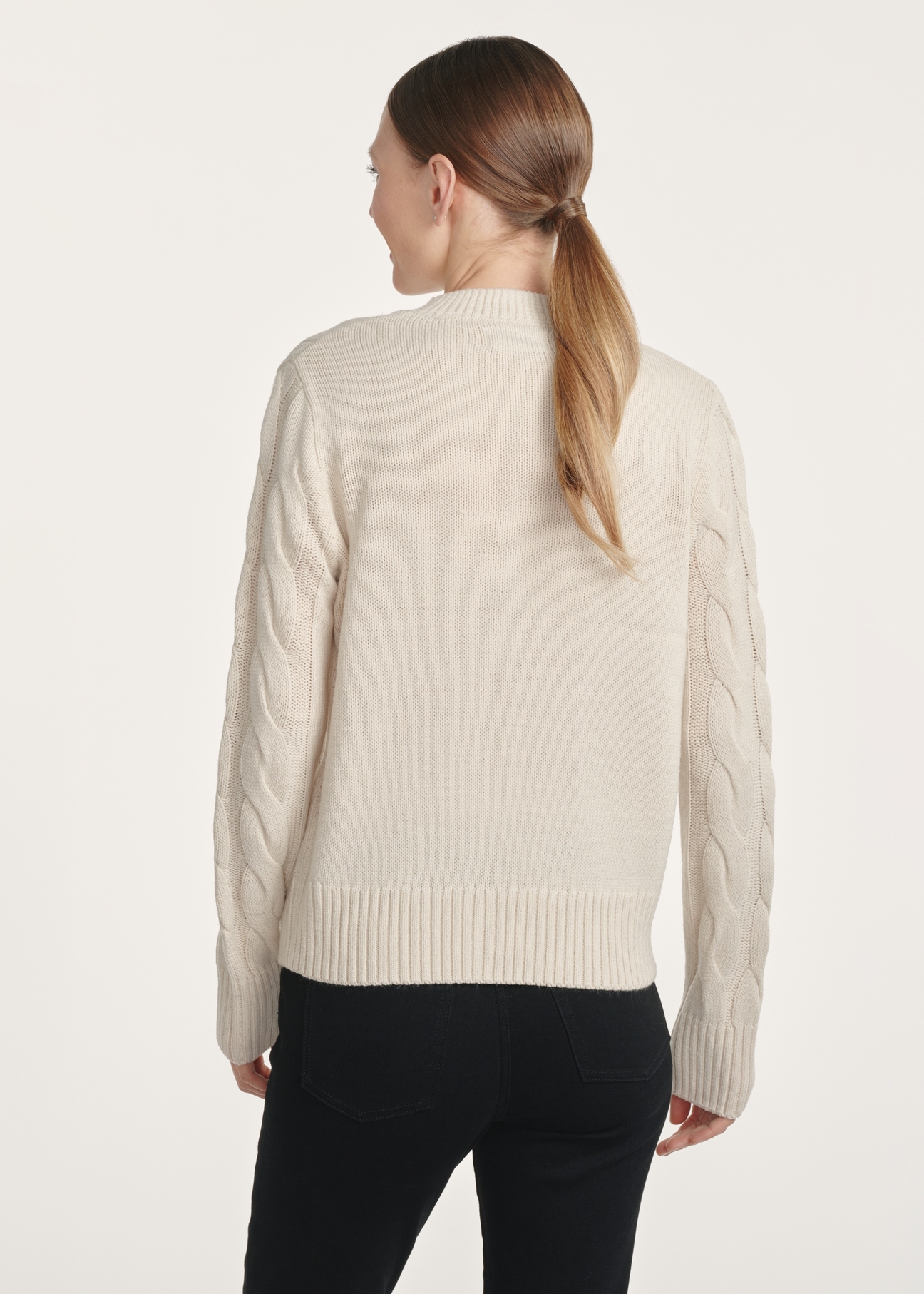 Light beige women's sweater with decorative weave SWEDT-0210-80(Z25), product view from the back on the model. Half of the silhouette visible.