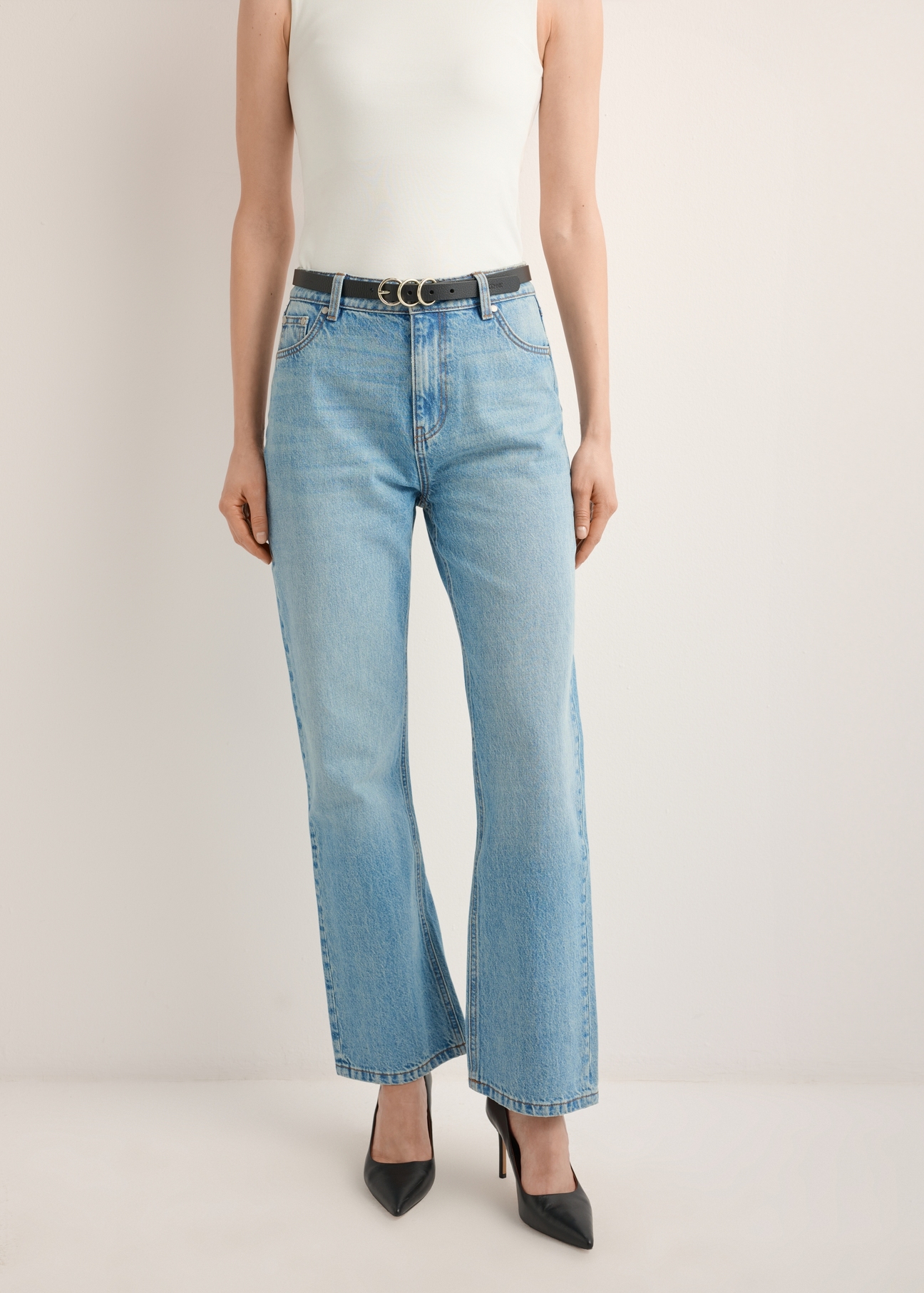 Women's blue denim pants JEADT-0016-7A(Z26), front view of the product on the model. Half of the silhouette visible.