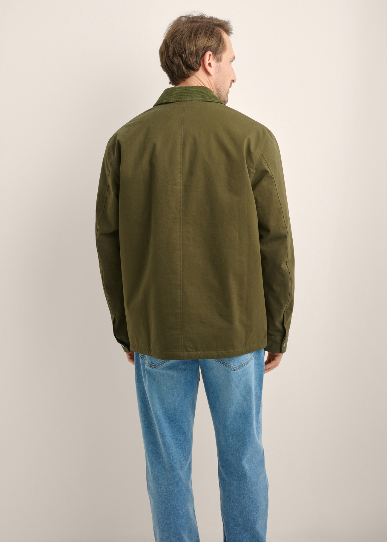 Men's green transitional jacket KURMT-0440-8B(Z26), product view from the back on the model. Half of the silhouette visible.