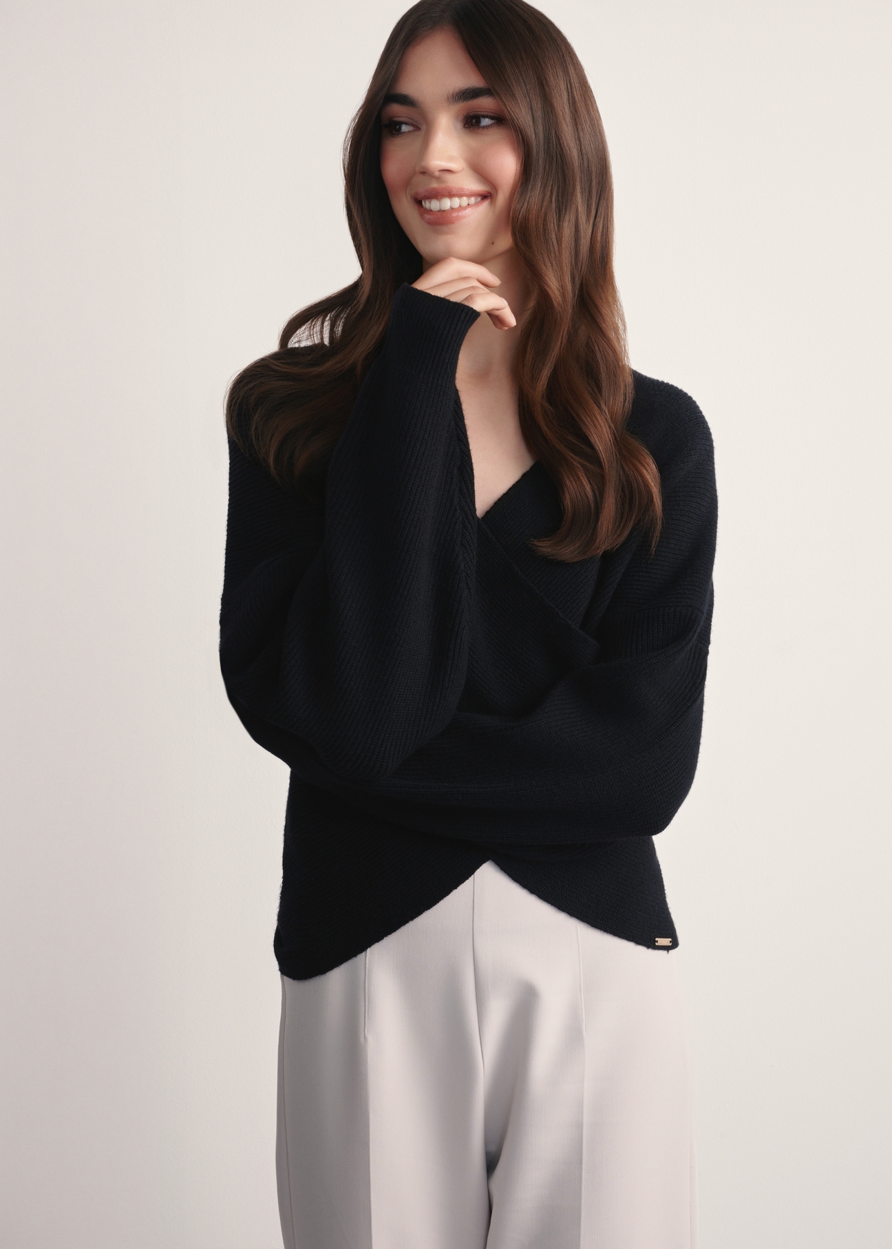Black women's viscose sweater SWEDT-0240-99(Z25), front view of the product on the model. Half of the silhouette visible.