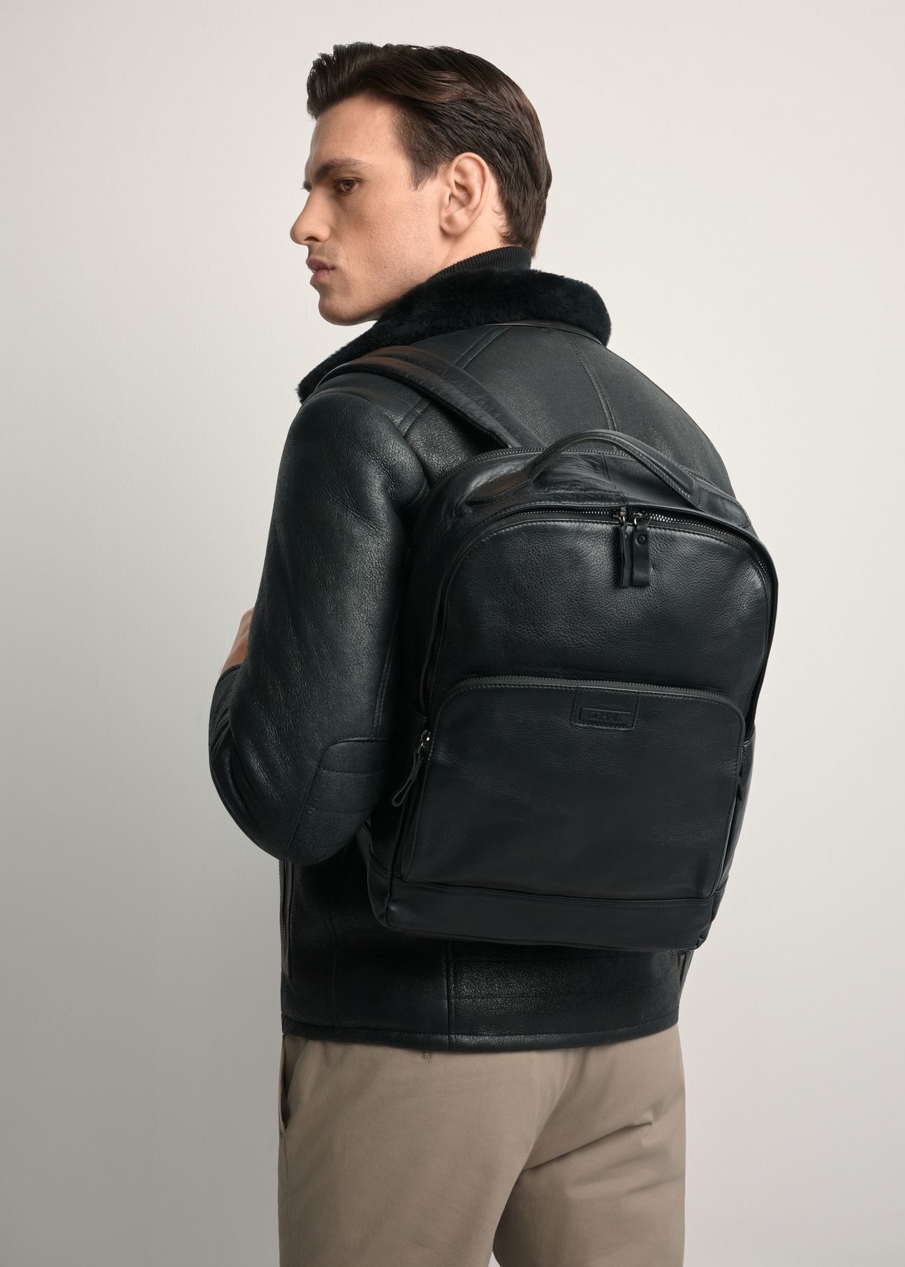 Large black leather men's backpack PLCMS-0020A-99(Z25), product image on the model's silhouette.