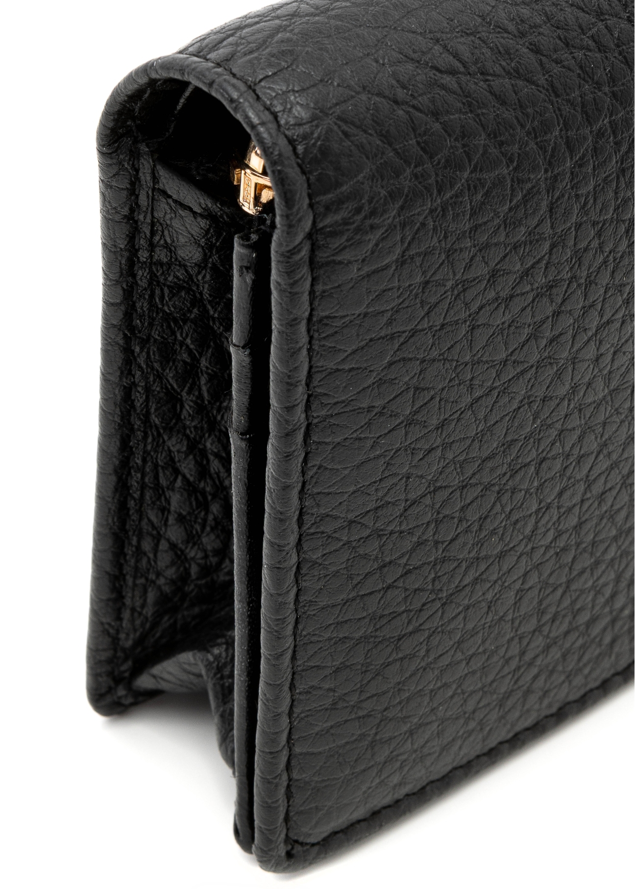 Black leather women's wallet PORES-0944G-99(Z25), close-up of the product detail, view on a light background.