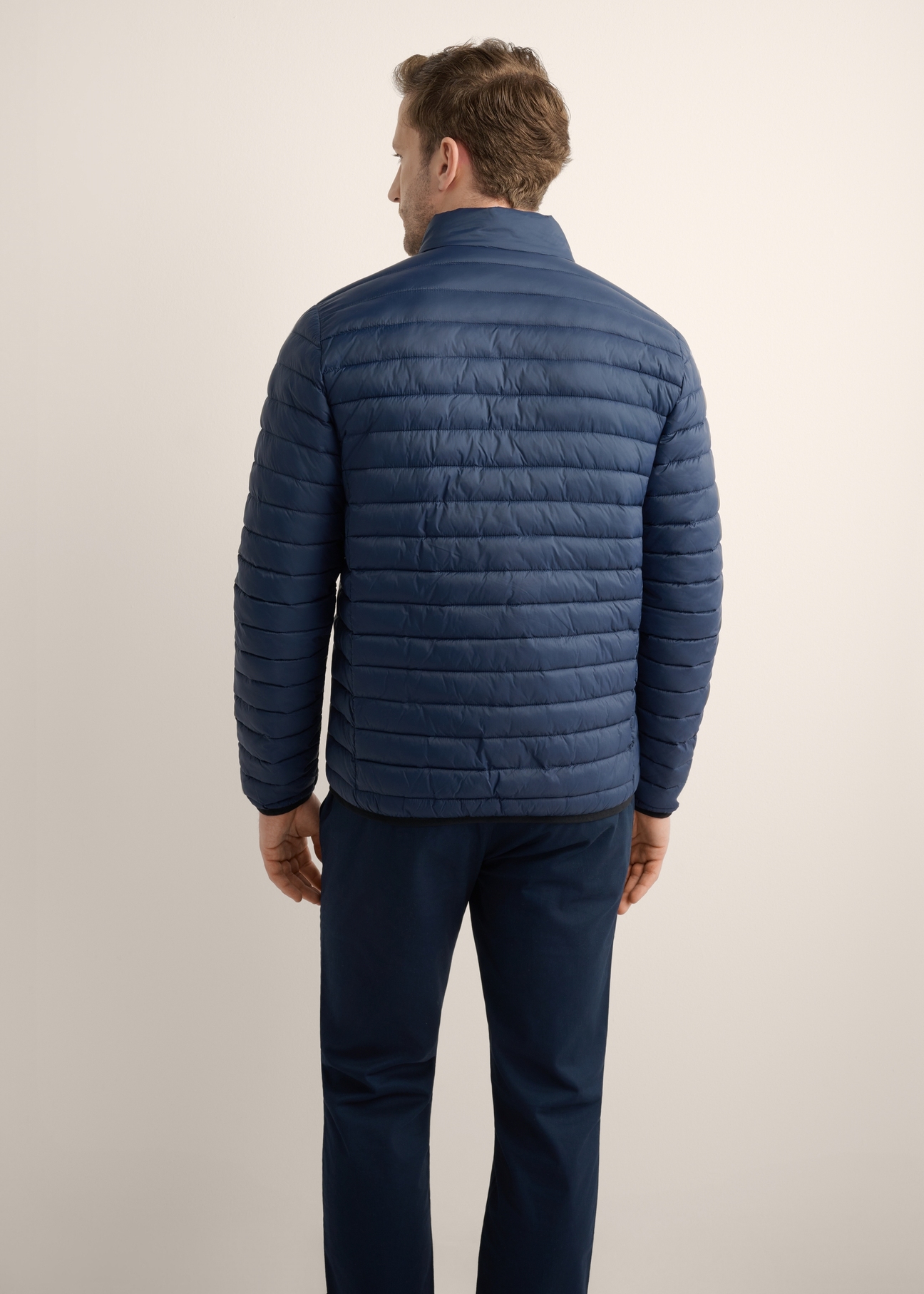 Navy blue men's transitional jacket KURMT-0382-7E(Z26), product view from the back on the model, half of the silhouette visible.