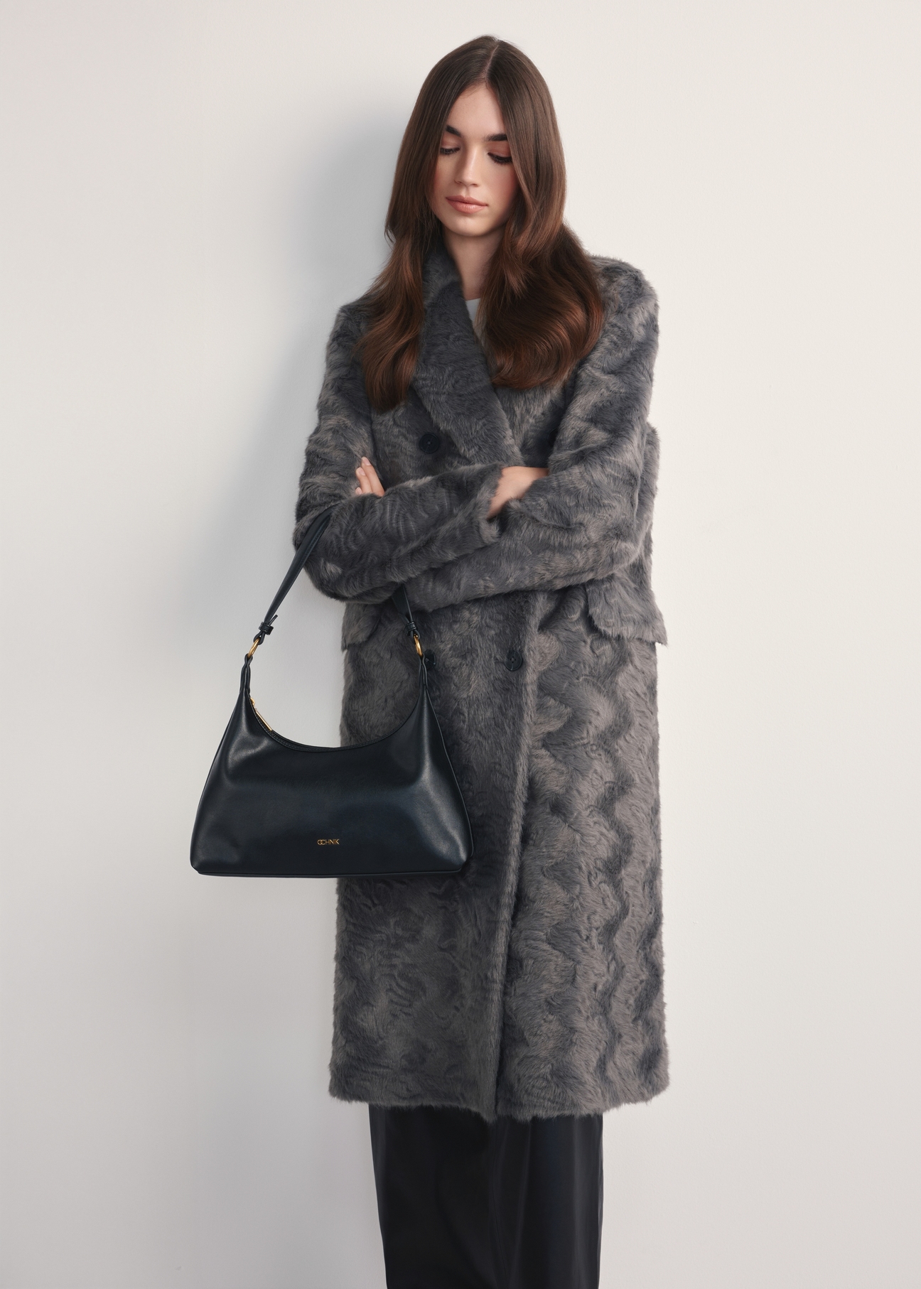 Black women's handbag TOREC-1082-99(Z25) - front view of the product on a model, against a white background. Full body visible.