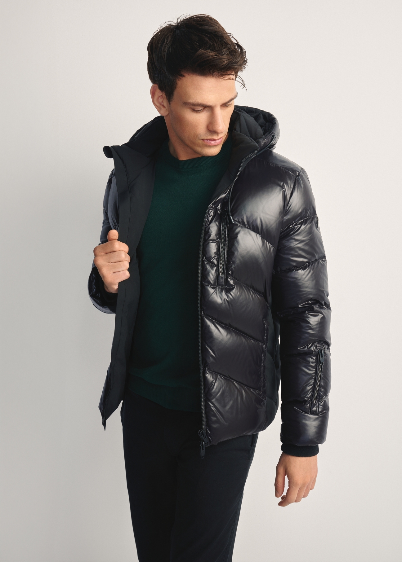 Men's black jacket with natural insulation KURMT-0393-99(Z25) - front view of the product on a model, against a white background. Knee-length silhouette visible.