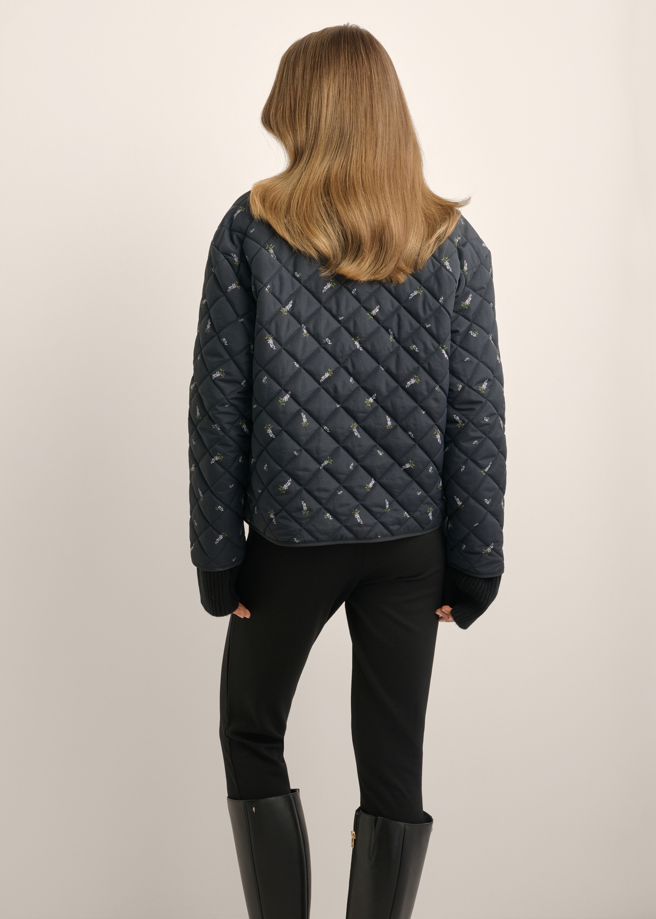 Women's reversible jacket with a lilac pattern KURDT-0710-99(Z26), product view from the back on the model. Half of the silhouette visible.