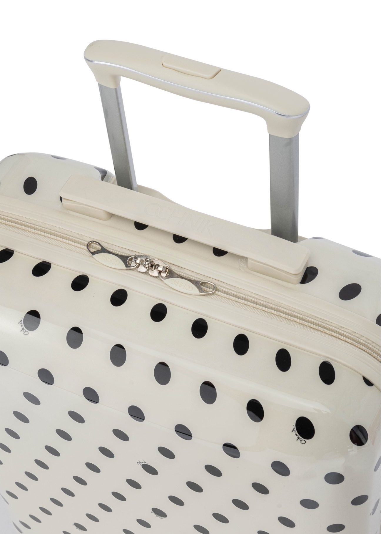 Small polka dot suitcase on wheels WALAB-0074-0P-19(W26), view of the product handle on a white background.
