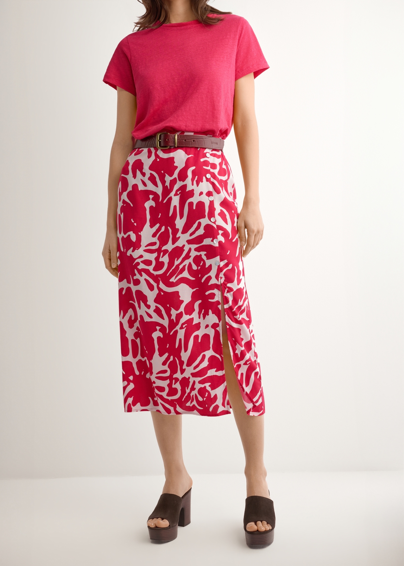 Pink viscose midi skirt SPCDT-0129-5P(W26), front product view on model. Half silhouette visible.