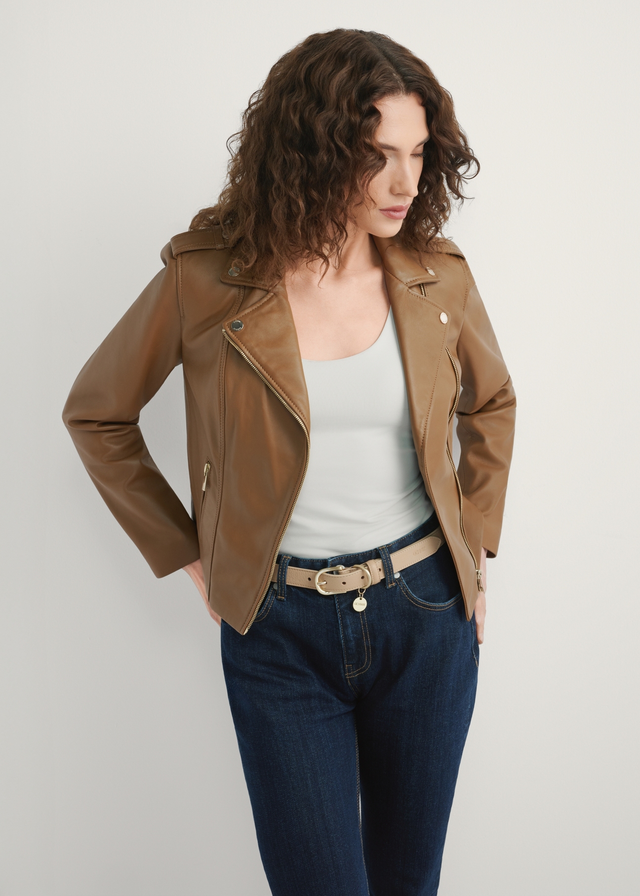 Women's beige leather jacket KURDS-0601-1B(W26), front view of the product on the model. Half of the silhouette visible.