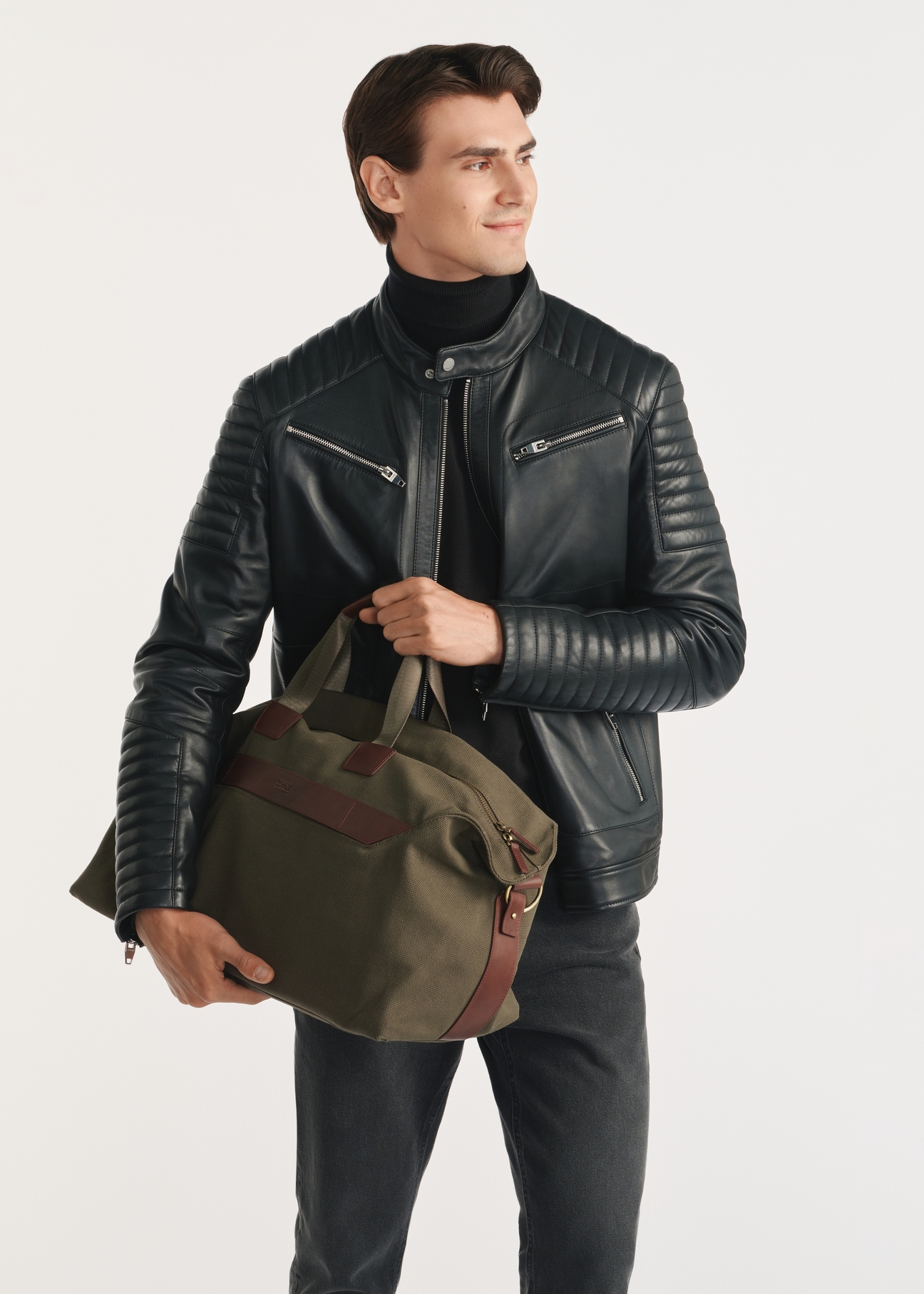 Khaki TORMN-0372-55(Z25) travel bag - product view on model, on white background. Knee-length silhouette visible.