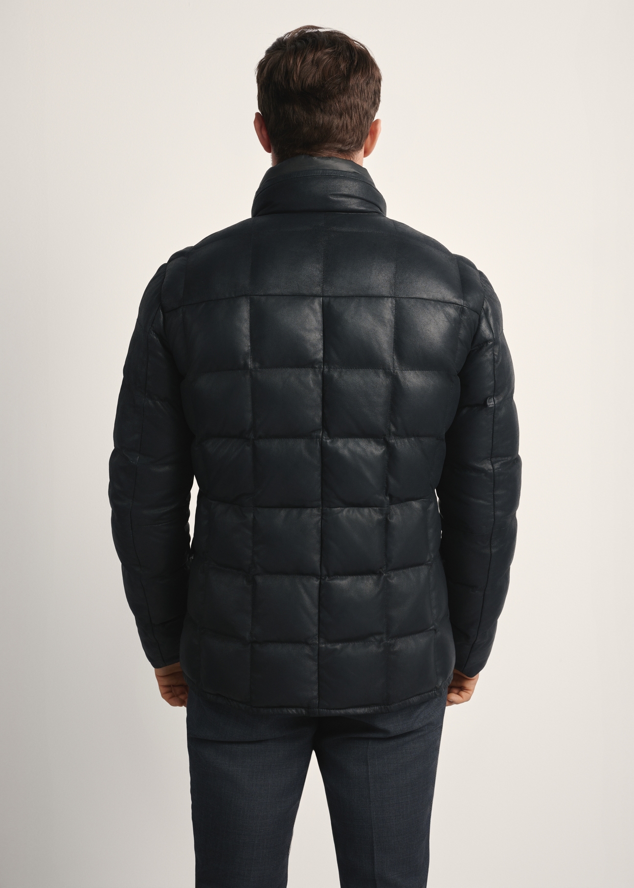 Black men's leather insulated jacket KURMS-0375-2872(Z25), product view from the back on the model, half of the silhouette visible.