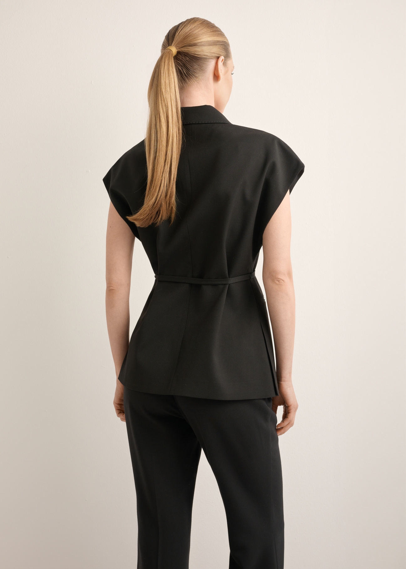Women's black oversize suit vest KAMDT-0039-99(Z26), back view of the product on the model. Half of the silhouette visible.