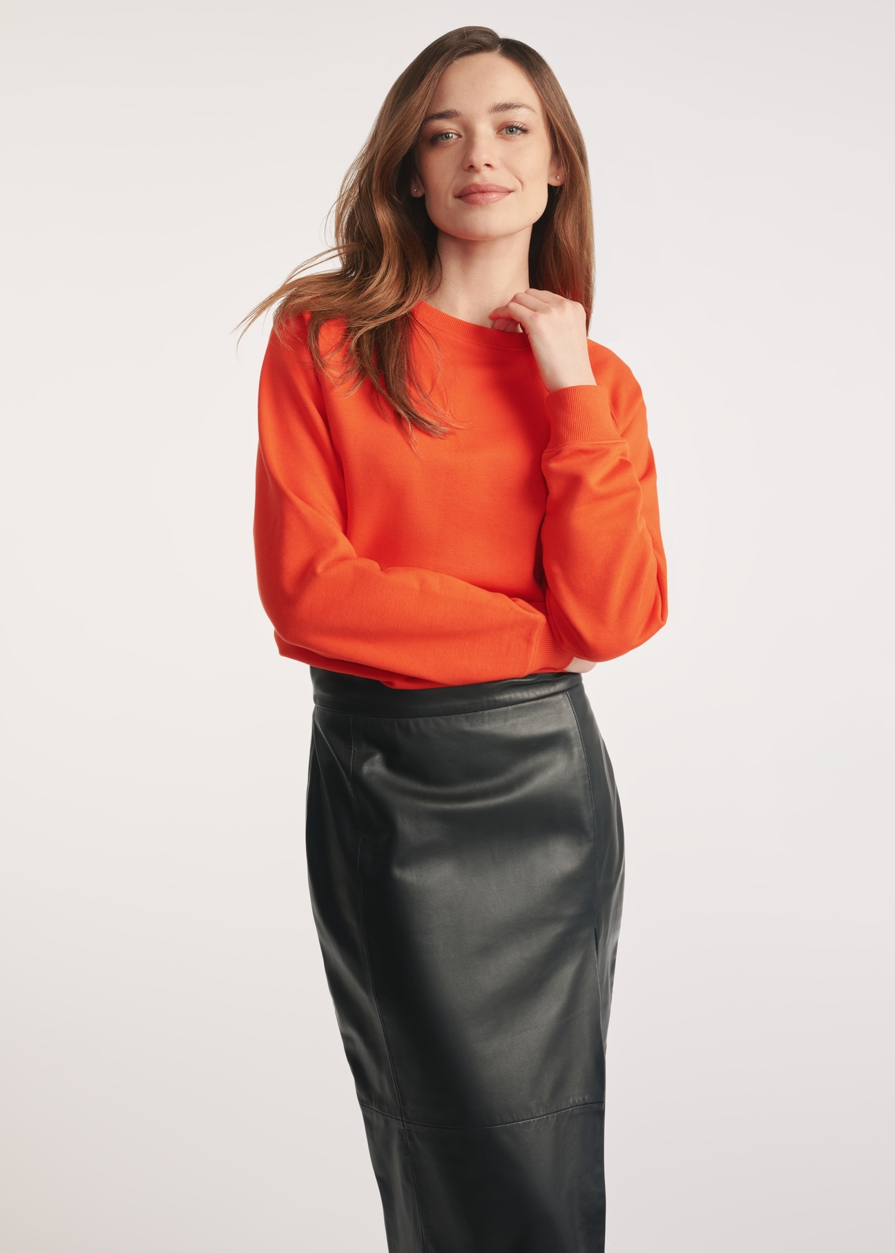 Orange women's sweatshirt BLZDT-0114-30(Z25) - front view of the product on a model on a white background. Knee-length silhouette visible.