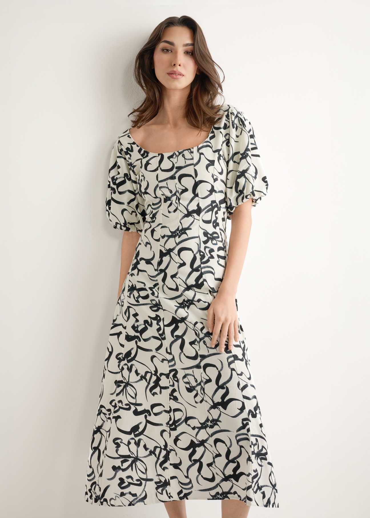 Women's floral dress SUKDT-0277-0P(W26), front view of the product on the model. Half of the silhouette visible.