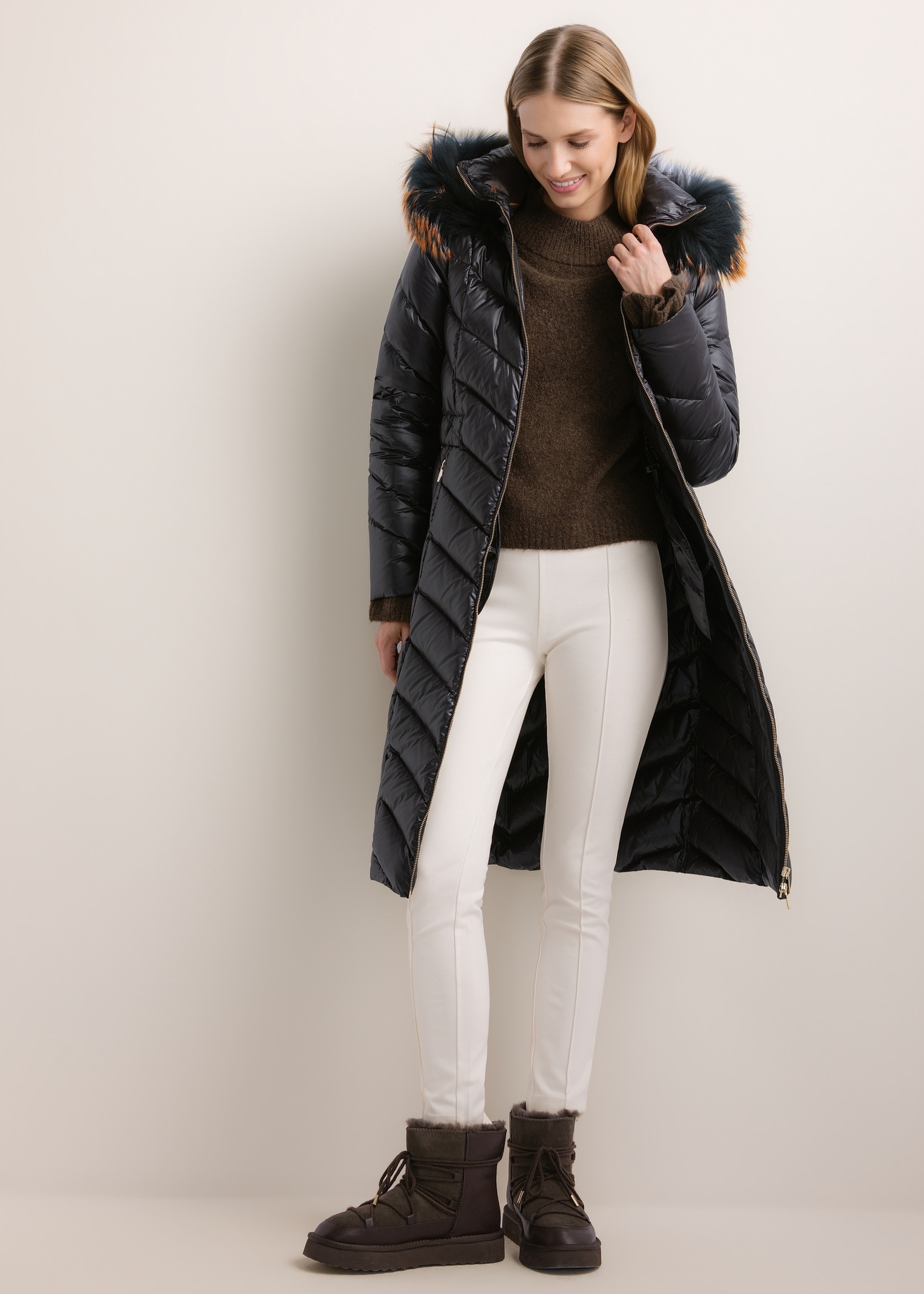 Women's jacket with raccoon fur (KURDT-0712-99(Z26)), front view on a model. Full-body shot.