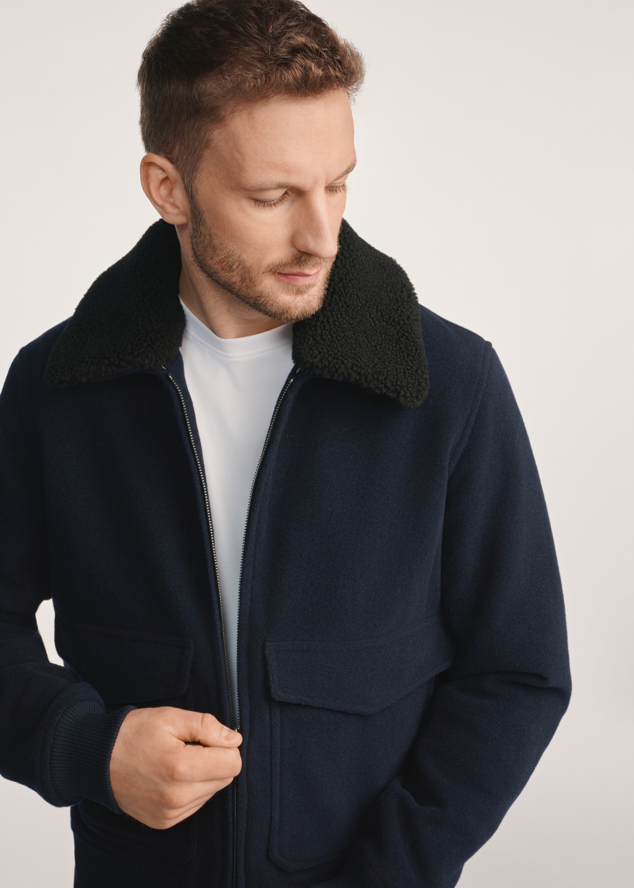Navy blue men's sheepskin jacket PLAMT-0009-69(Z25), product visible from the front on the model, half of the silhouette visible.-02