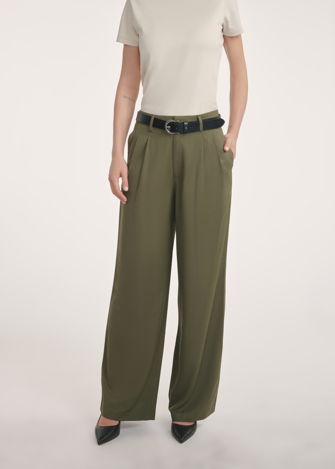Women's khaki trousers SPODT-0112-55(Z25), front view of the product on the model, half of the silhouette visible.