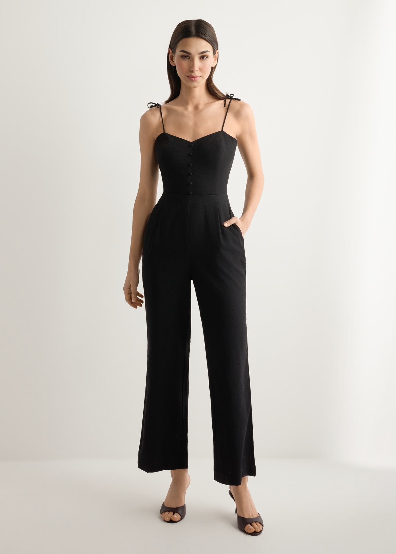 Women's black jumpsuit KOBDT-0011-99(W26), front view of the product on the model. Full body visible.
