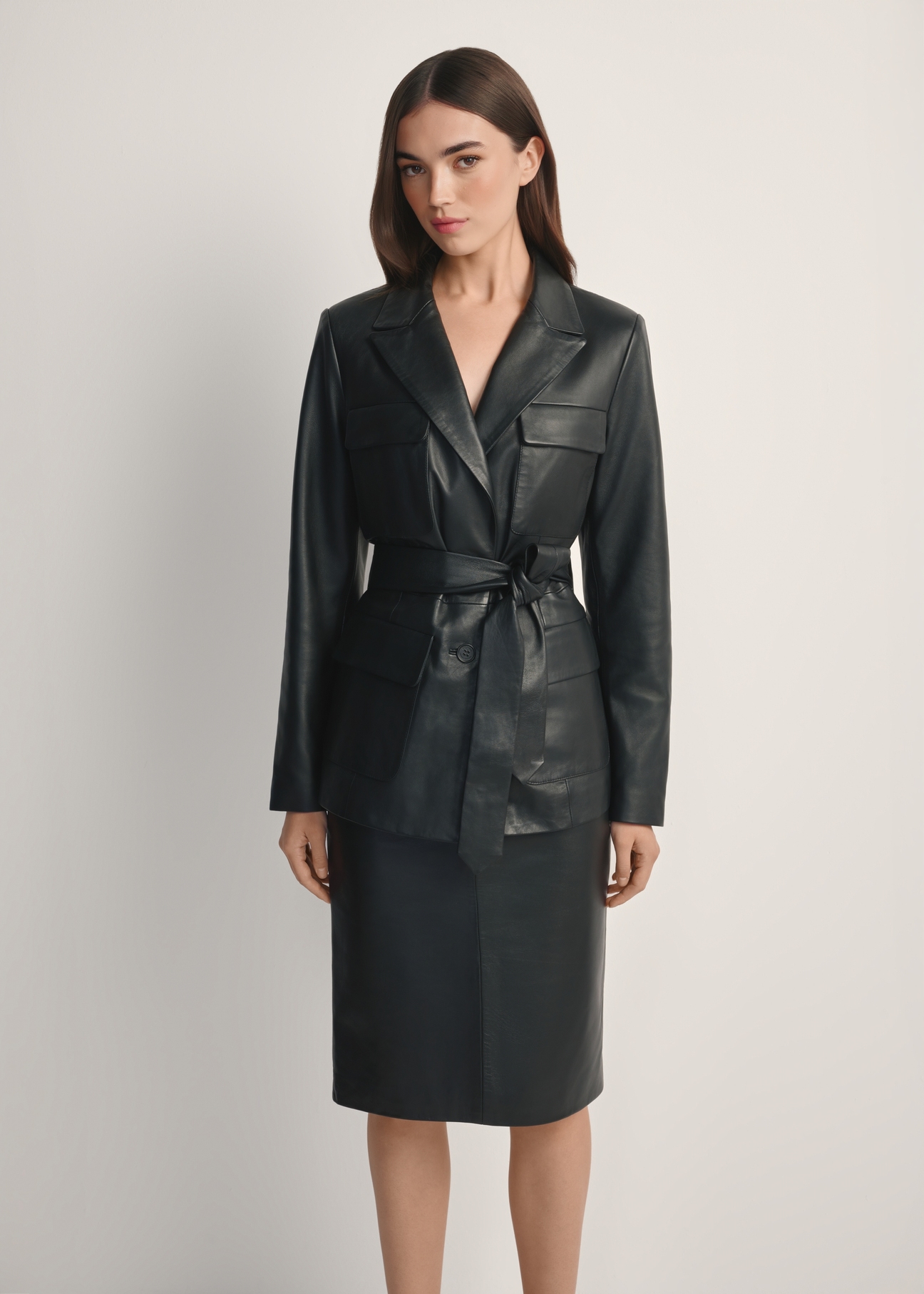 Women's black leather jacket with belt KURDS-0545-99(W26), front view of the product on the model. Half of the silhouette visible.