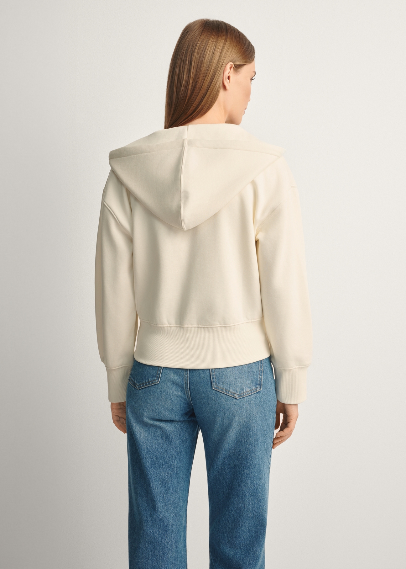 Cream women's hooded sweatshirt BLZDT-0113-12(Z25), product view from the back on the model, half of the silhouette visible.