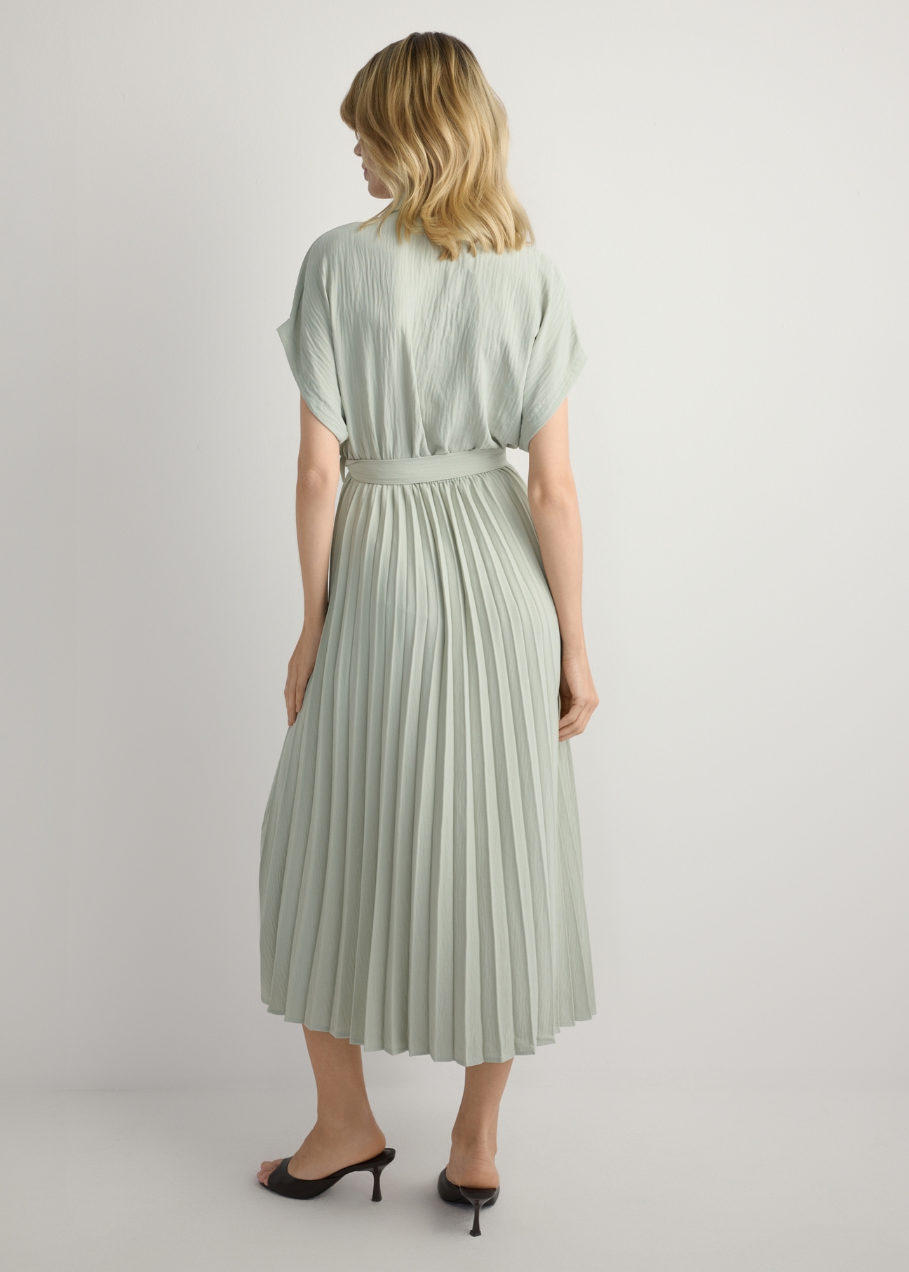 Long sage women's dress SUKDT-0274-8F(W26), back view of the product on the model. Full silhouette visible.