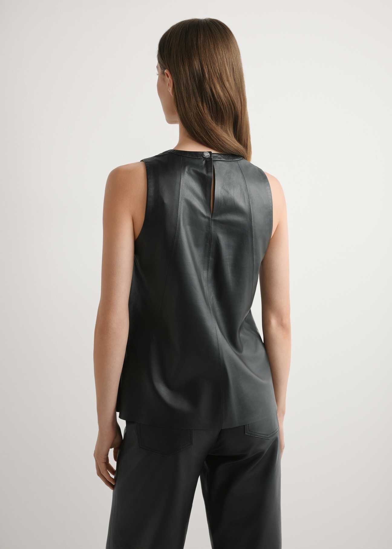 Women's black leather blouse KOSDS-0008-99(W26), back view of the product on the model. Half of the silhouette visible.