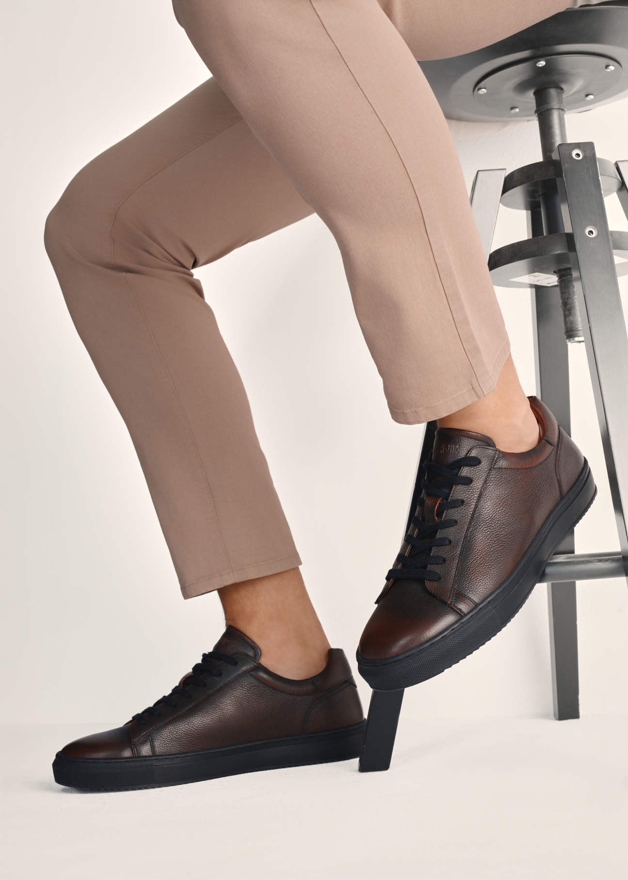 Men's brown leather shoes BUTYM-0519-09(Z25), product view on model's feet against light background.
