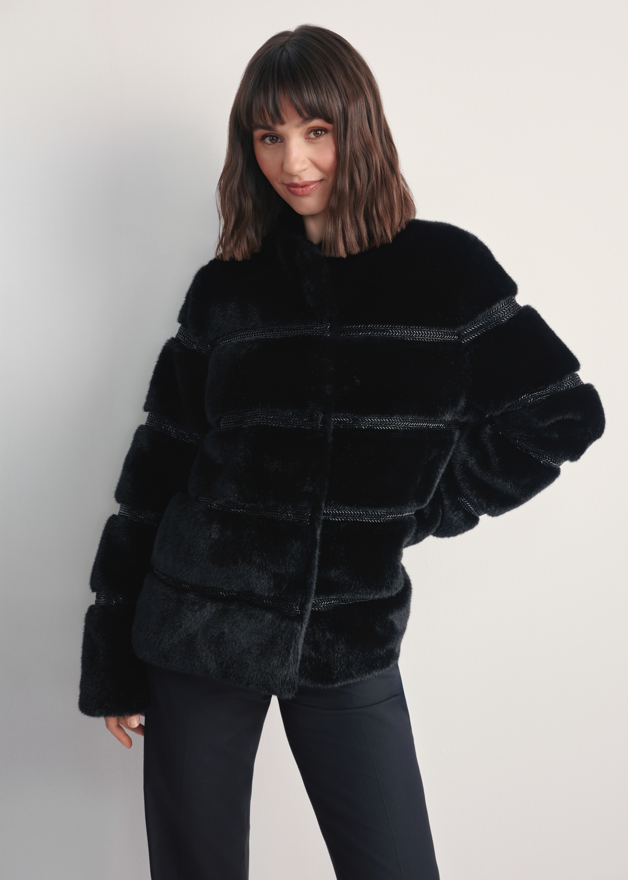 Women's black fur coat with appliqués FUTDP-0067-99(Z25) - front view of the product on a model against a white background. Knee-length silhouette visible.