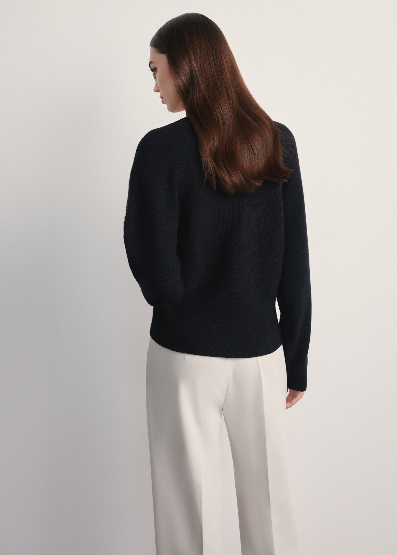 Women's black viscose sweater SWEDT-0240-99(Z25), back view of the product on the model. Half of the silhouette visible.