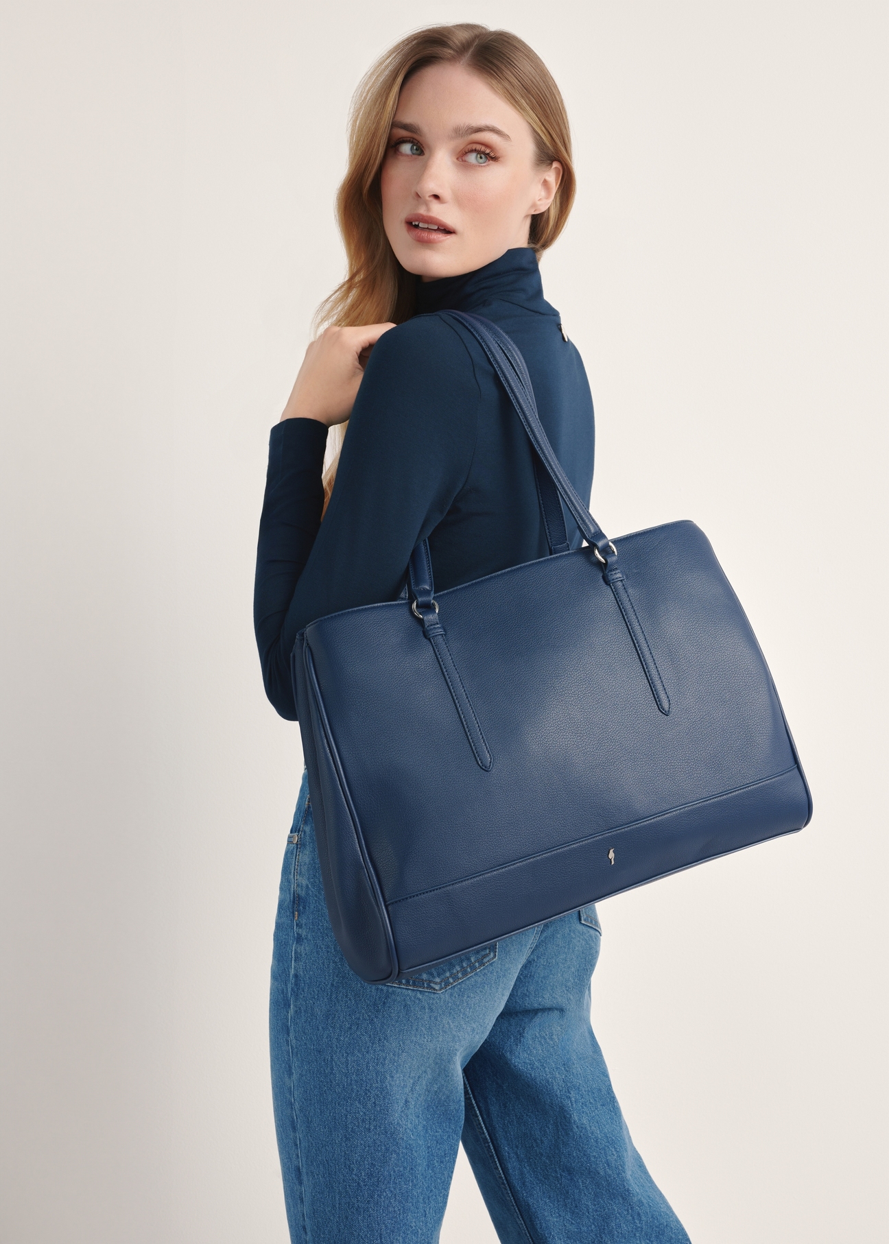 Large navy blue women's bag TOREC-1064-69(Z25), product view on model's shoulder. Half of silhouette visible.