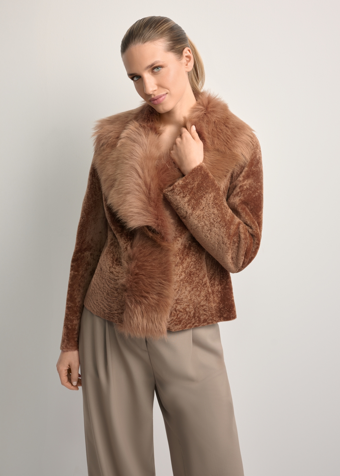 Women's camel-colored leather sheepskin coat KOZDS-0095-3099(Z25), front view of the product on a model. Half of the silhouette visible.