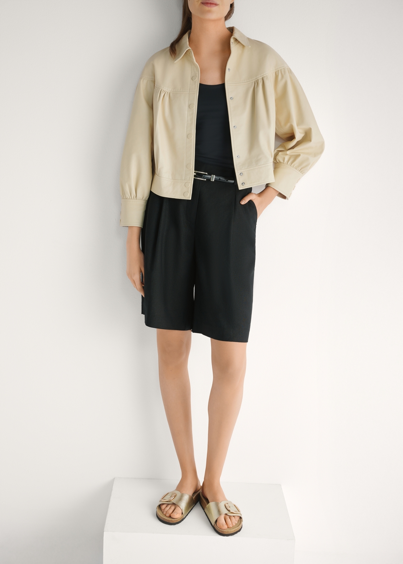 Women's gold leather slides BUTYD-1157-2X(W26), front view of the product on the model's feet.