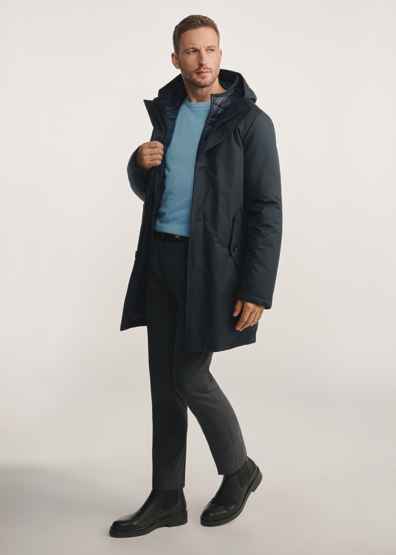 Navy blue men's winter jacket KURMT-0387-69(Z25), product visible from the side on the model, the entire silhouette is visible.