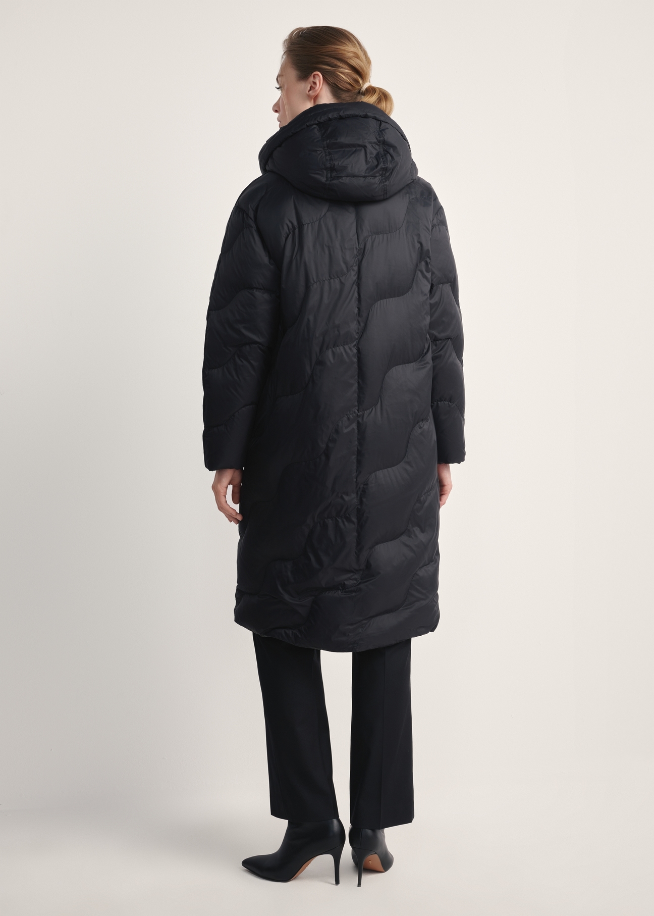 Women's black winter jacket KURDT-0604-99(Z25) - back view of the product on a model against a white background. Full body visible.