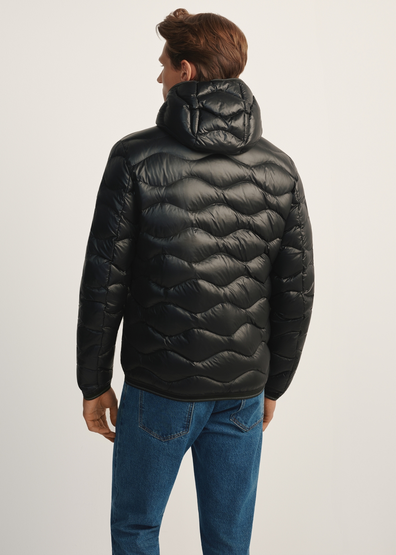 Men's black quilted jacket KURMT-0400-99(Z25), product view from the back on the model. Half of the silhouette visible.