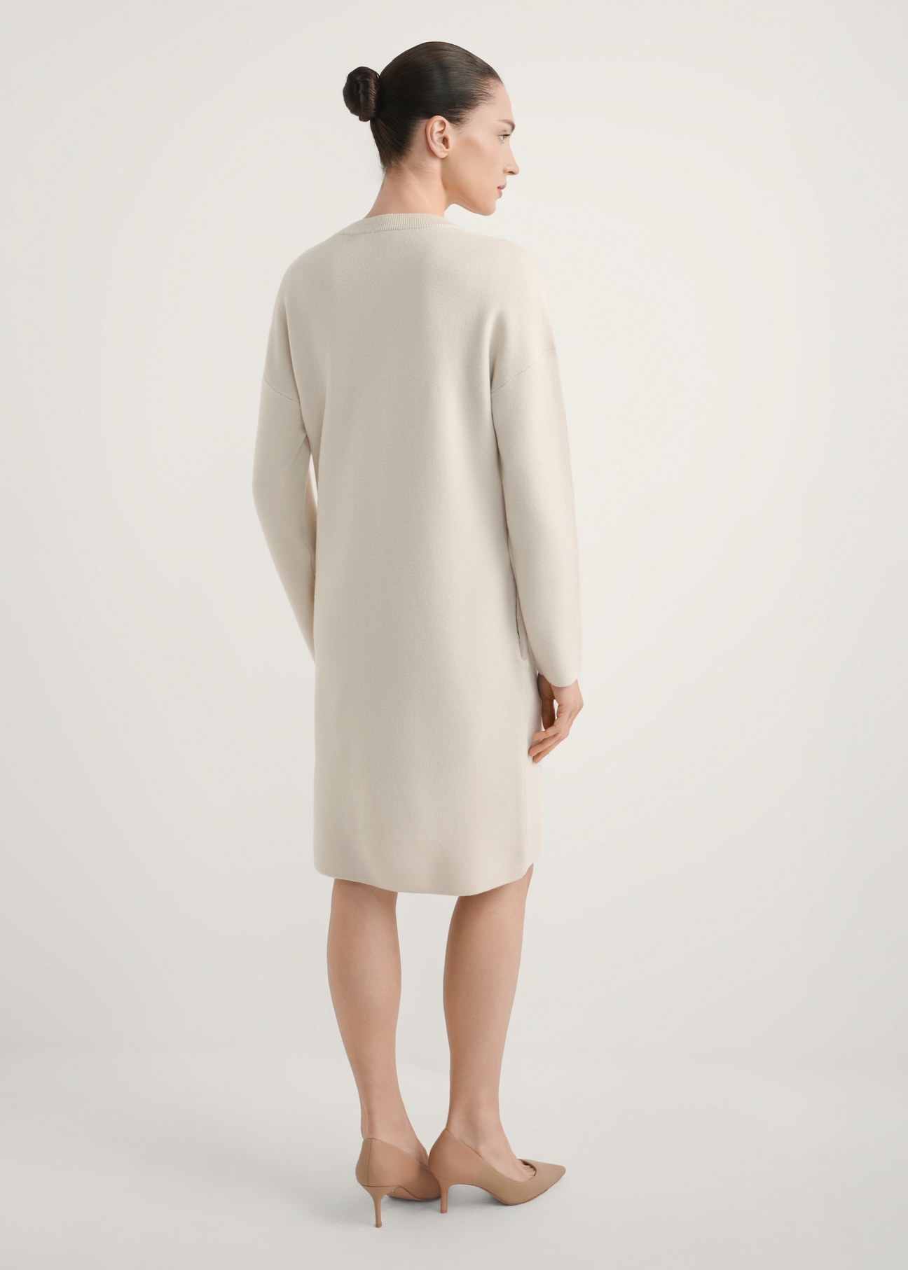 Beige women's dress SUKDT-0260-1A(W26), back view of the product on the model. Full body visible.