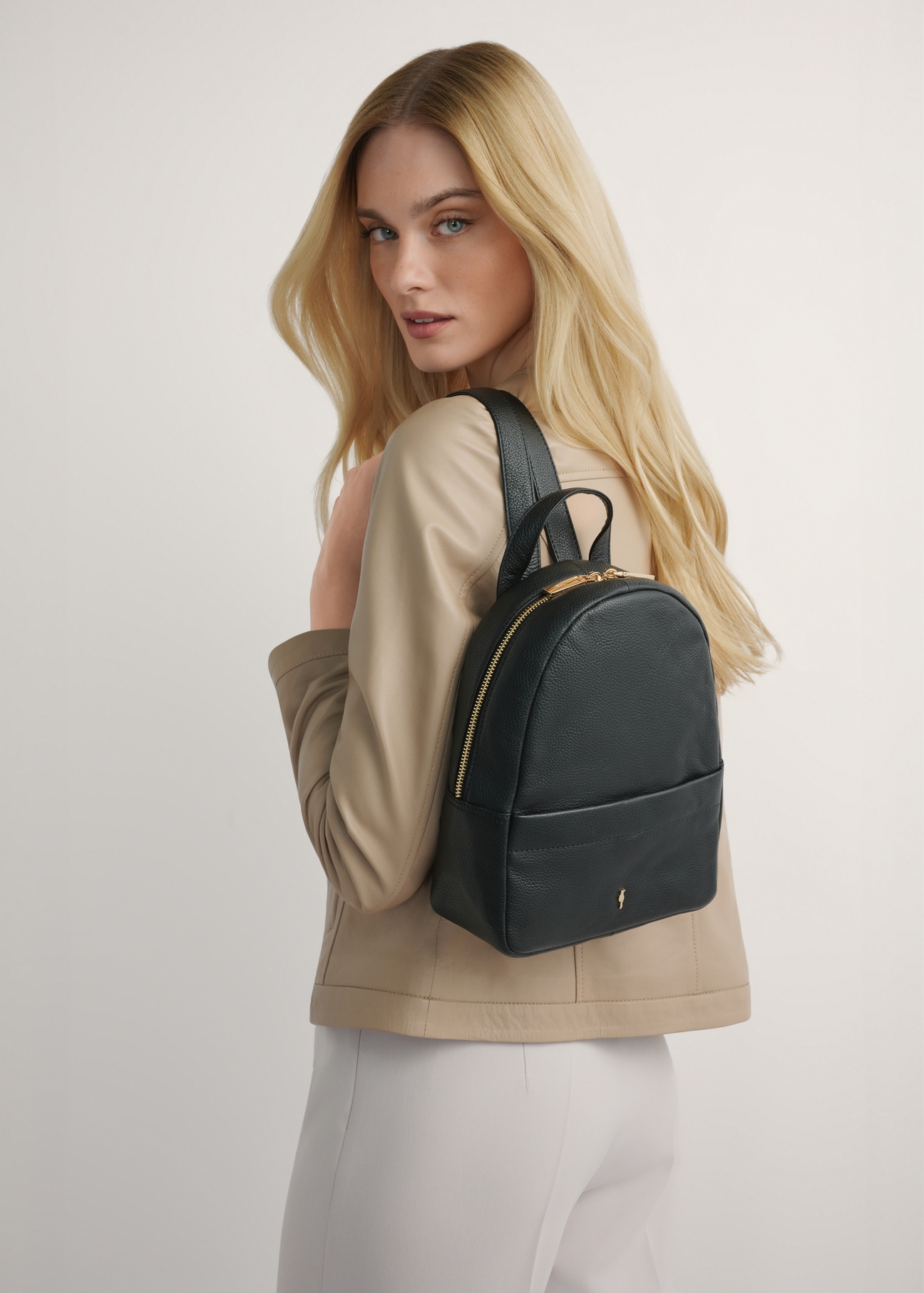 Black medium leather women's backpack TORES-1268-9I(W26), product view from the front on the model, half of the silhouette visible.