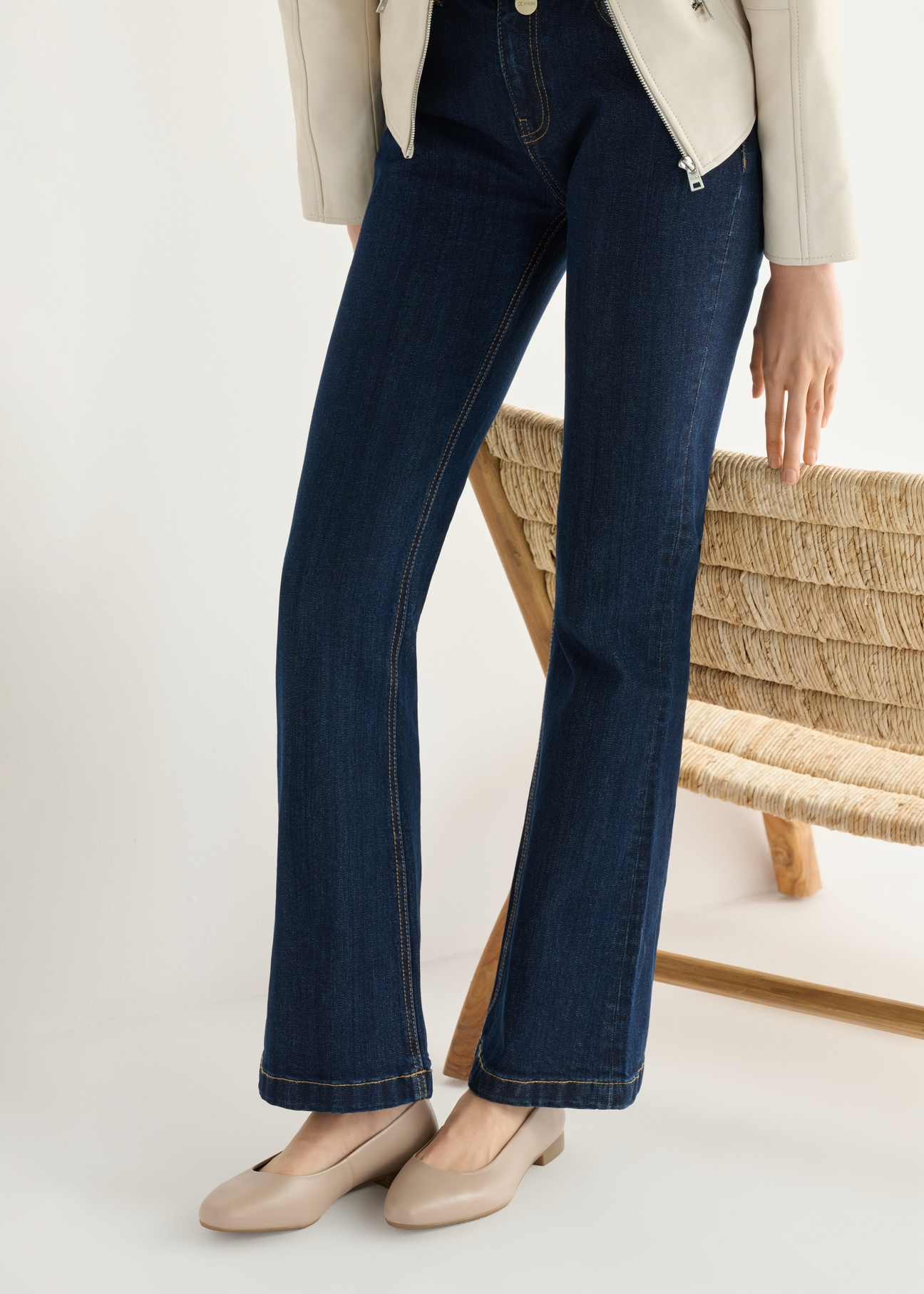 Beige leather women's ballet flats BUTYD-1049B-1B(W26), side view of the product on the model, half of the silhouette visible.