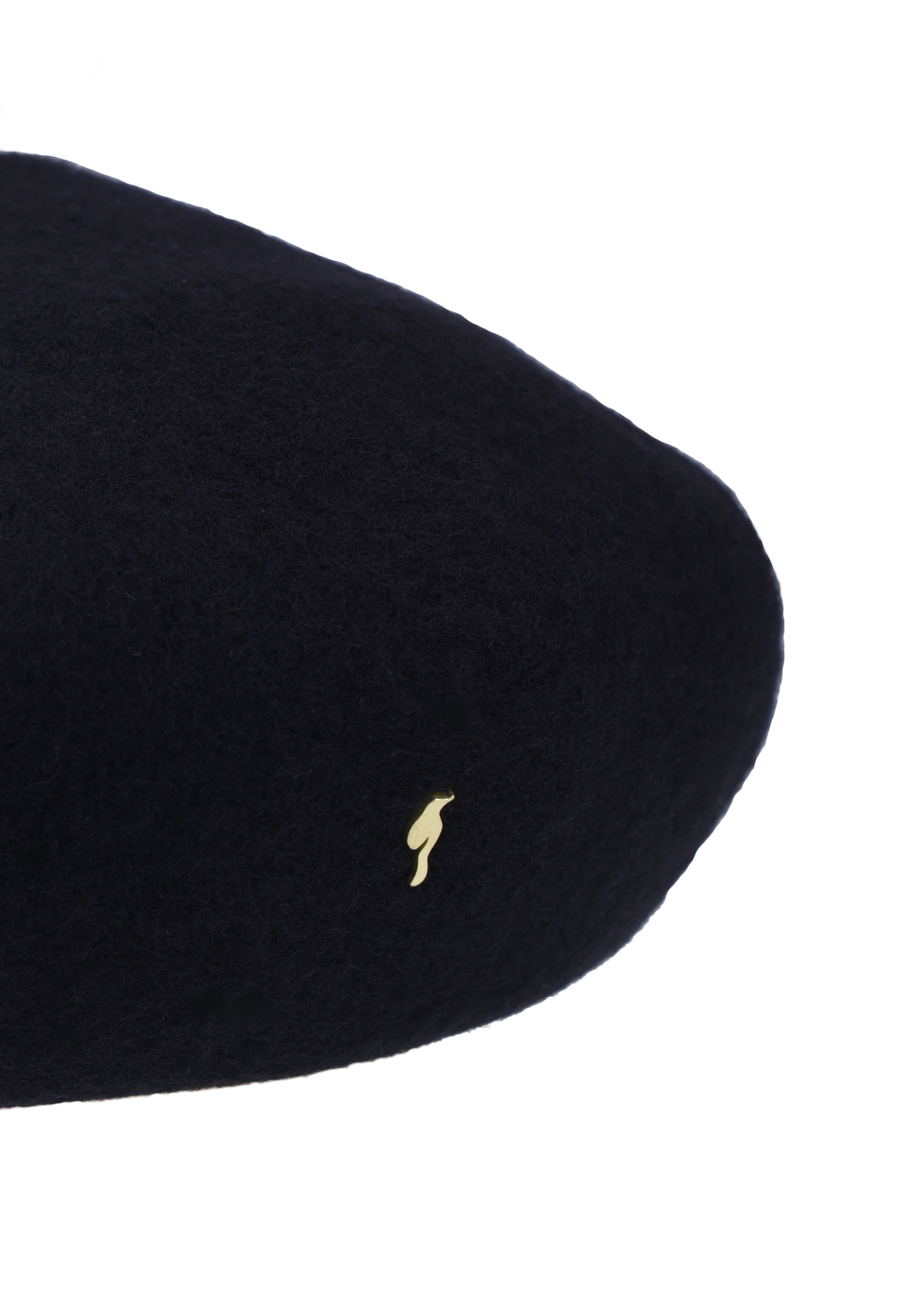 Black woolen women's beret CZADT-0234-99(Z26) - close-up of detail, on white background.
