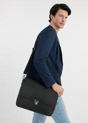 Black leather men's document briefcase TORMS-0449-99(W25), front product view on the model. Half of the silhouette visible.