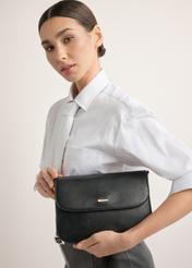 Black women's shoulder bag TOREC-1262-9F(Z26), front view of the product on a model. Half of the silhouette visible.