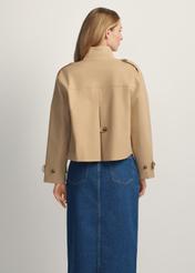 Beige women's transitional jacket KURDT-0628-1B(W26) - back view of the product, on a model, against a light background. Knee-length silhouette visible.