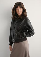 Women's brown leather jacket KURDS-0609-1I(W26), front view of the product on the model. Half of the silhouette visible.